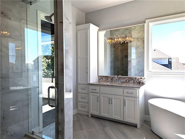 bathroom featuring vanity and plus walk in shower