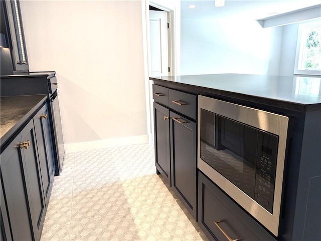 kitchen with stainless steel microwave