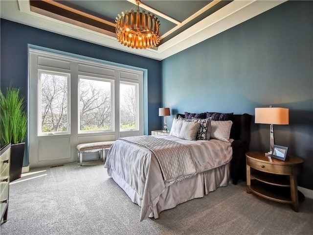 bedroom featuring carpet flooring and a raised ceiling