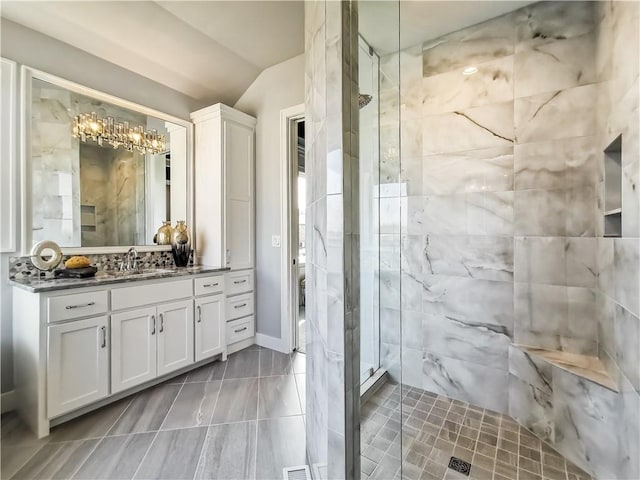 bathroom featuring vanity and an enclosed shower