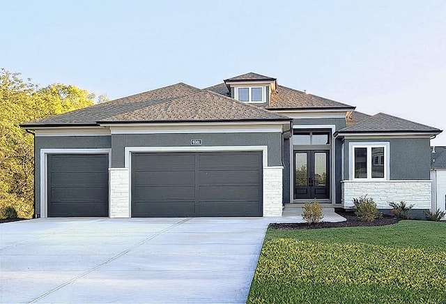 9301 W 168th St, Overland Park, KS 66085 - prairie-style home featuring a garage, french doors, concrete driveway, a front lawn, and stucco siding