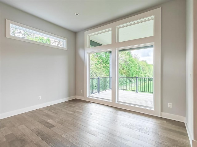 9301 W 168th St, Overland Park, KS 66085 - spare room with wood-type flooring and baseboards
