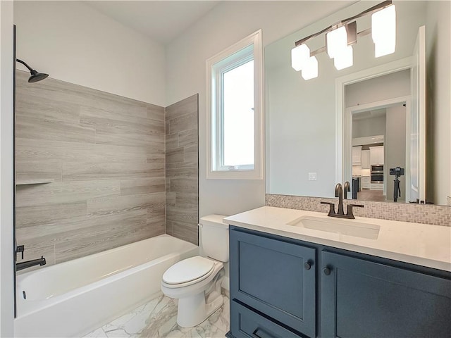 9301 W 168th St, Overland Park, KS 66085 - full bath featuring toilet, vanity, tub / shower combination, and marble finish floors