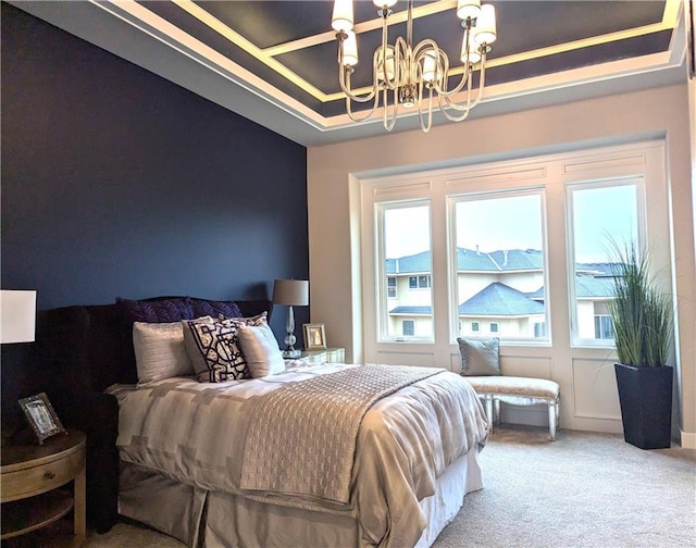 bedroom with carpet flooring and a notable chandelier