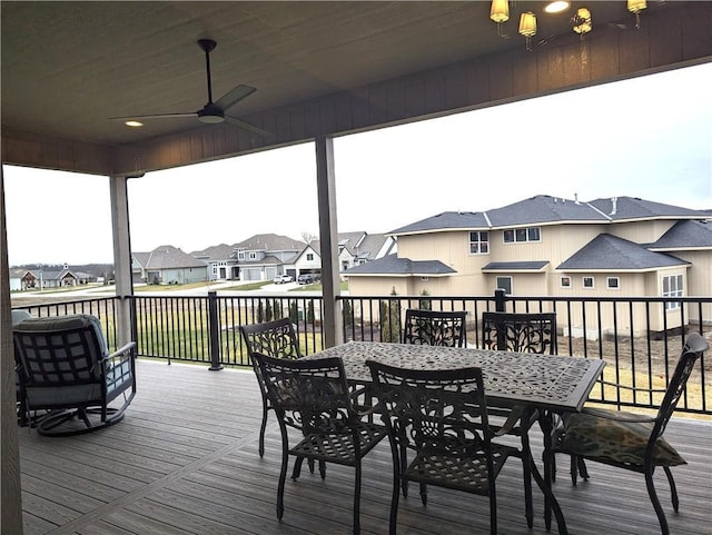 wooden deck featuring ceiling fan