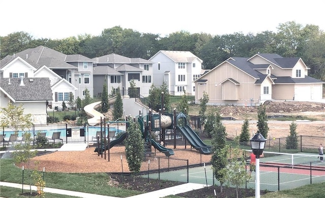 view of play area featuring tennis court