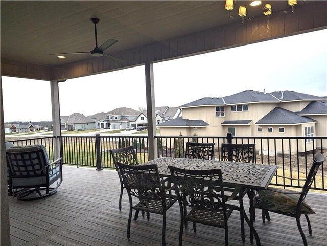 16724 Hayes St, Overland Park, KS 66085 - wooden terrace featuring a residential view, ceiling fan, and outdoor dining space
