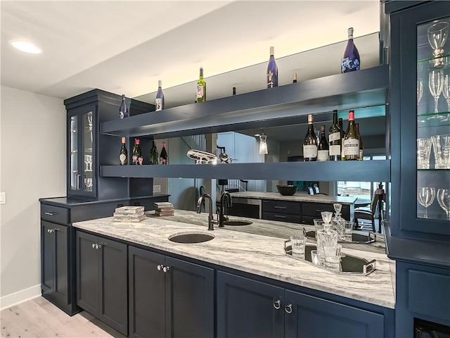 16724 Hayes St, Overland Park, KS 66085 - indoor wet bar featuring light wood-style floors and baseboards
