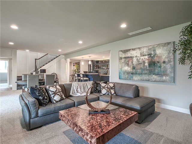 16724 Hayes St, Overland Park, KS 66085 - living area with carpet floors, recessed lighting, stairway, and baseboards