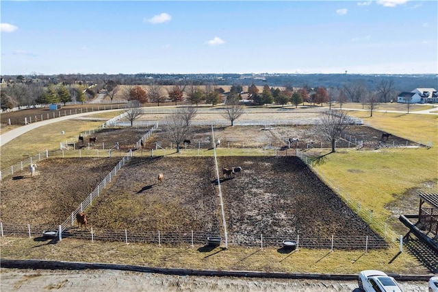 birds eye view of property with a rural view