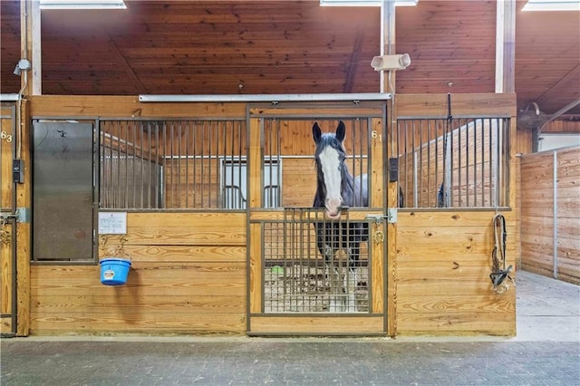 view of horse barn featuring an outdoor structure