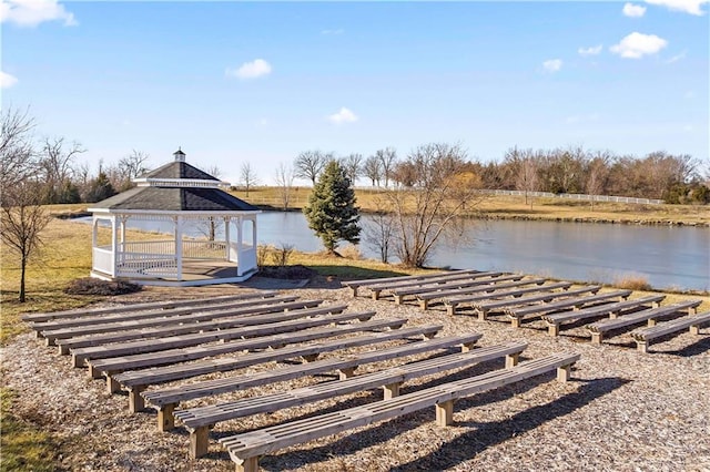 view of dock with a gazebo and a water view