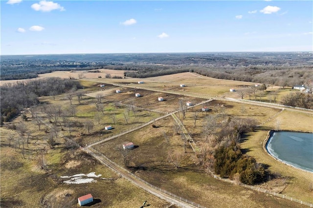 birds eye view of property with a rural view and a water view