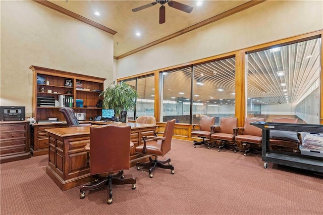 office space with ceiling fan, dark carpet, and a high ceiling