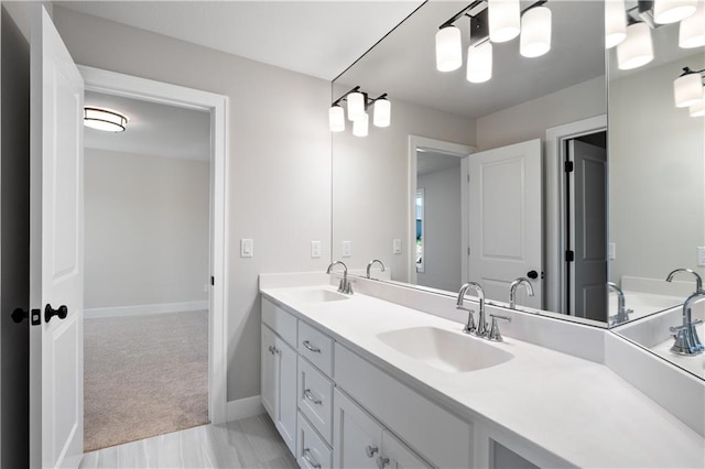 bathroom with large vanity, double sink, and tile flooring