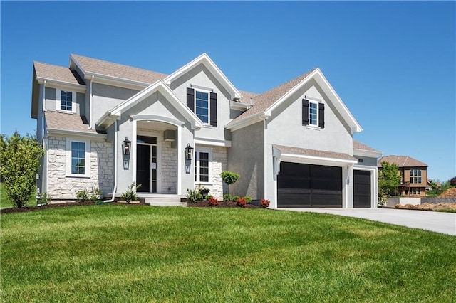 view of front of house featuring a front lawn and a garage