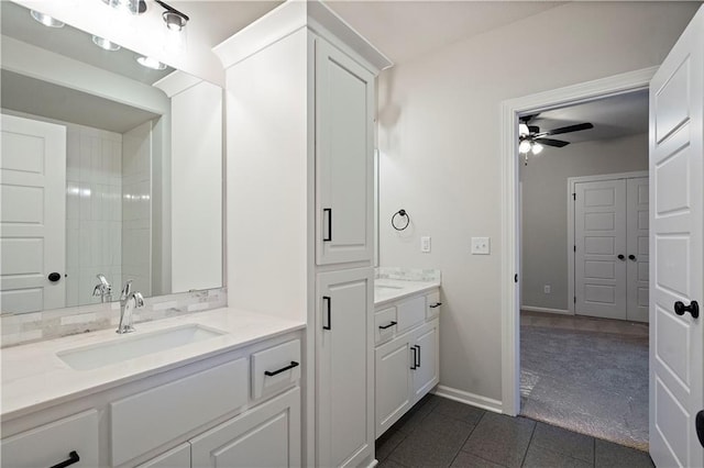 bathroom with ceiling fan, tile floors, and vanity