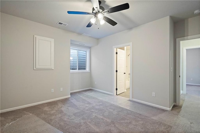 unfurnished bedroom with light carpet, connected bathroom, and ceiling fan