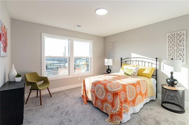 bedroom with light colored carpet