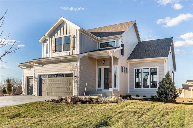 view of front facade featuring a garage and a front lawn