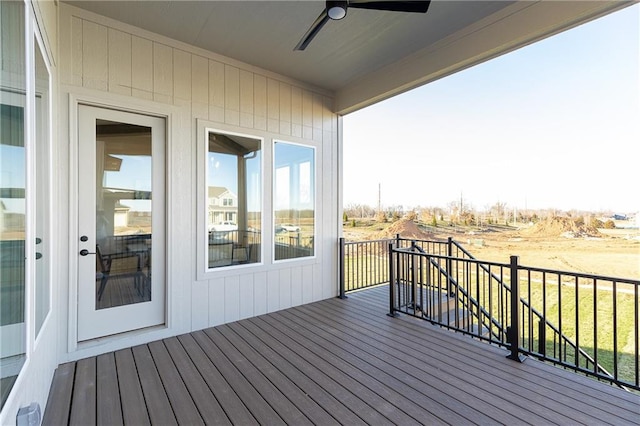 wooden terrace featuring ceiling fan