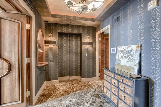 bathroom featuring a raised ceiling