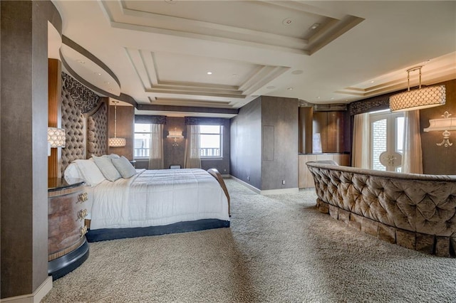 bedroom featuring a raised ceiling and carpet