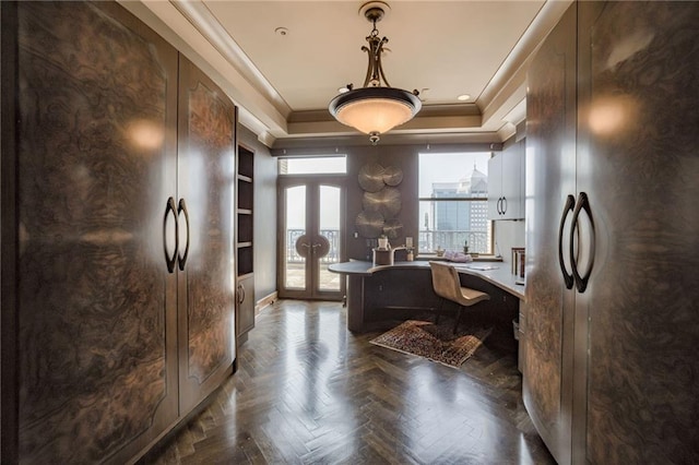 office space featuring crown molding, dark parquet floors, and french doors