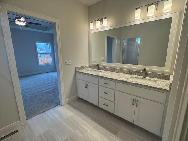 bathroom featuring vanity and ceiling fan