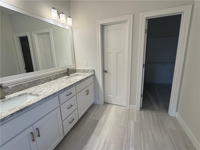 bathroom with vanity and hardwood / wood-style flooring