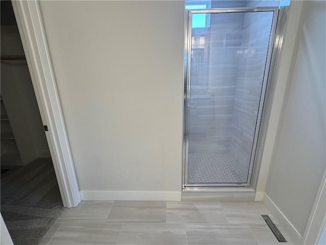 bathroom featuring an enclosed shower