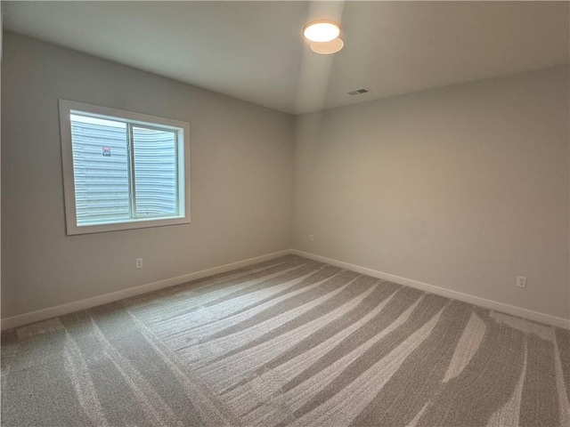 empty room featuring carpet flooring