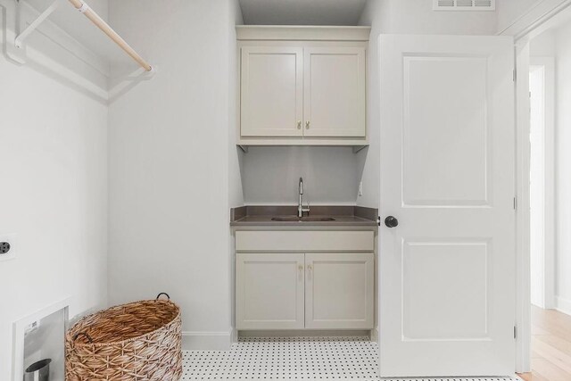 16735 S Hall St, Olathe, KS 66062 - laundry room featuring cabinets and sink