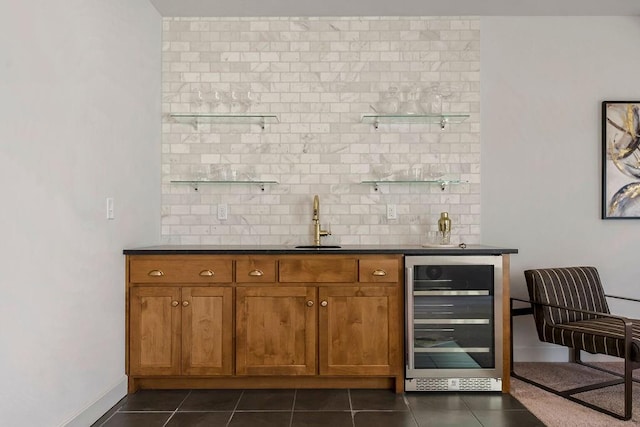 16735 S Hall St, Olathe, KS 66062 - bar with wine cooler, dark tile patterned floors, sink, and backsplash