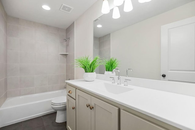 16735 S Hall St, Olathe, KS 66062 - full bathroom featuring tile patterned floors, toilet, tiled shower / bath combo, and vanity