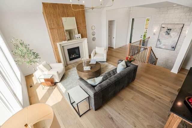 16735 S Hall St, Olathe, KS 66062 - living room with a notable chandelier and wood-type flooring