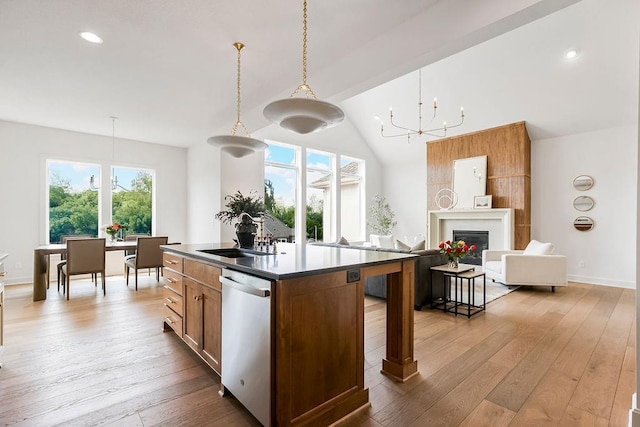 16735 S Hall St, Olathe, KS 66062 - kitchen with sink, decorative light fixtures, stainless steel dishwasher, a kitchen island with sink, and light hardwood / wood-style floors