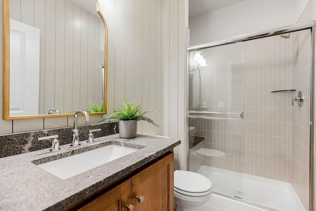 16735 S Hall St, Olathe, KS 66062 - bathroom featuring vanity, toilet, and a shower with shower door