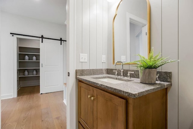 16735 S Hall St, Olathe, KS 66062 - bathroom featuring vanity and hardwood / wood-style flooring