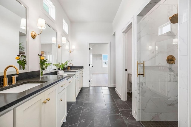 16735 S Hall St, Olathe, KS 66062 - bathroom featuring a shower with door, vanity, and toilet