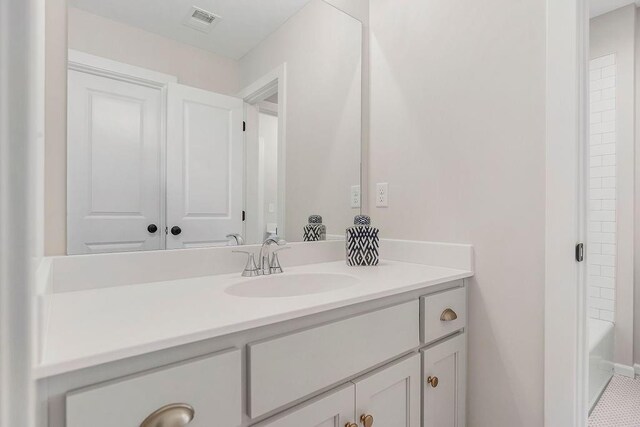 16743 S Hall St, Olathe, KS 66062 - full bathroom with vanity, a bathing tub, and visible vents