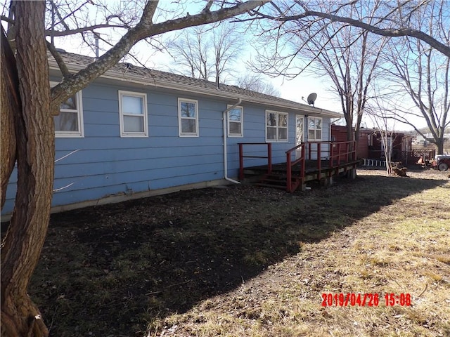 rear view of property with a deck