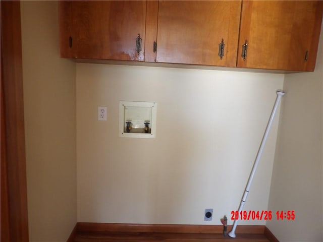 laundry room with cabinets, washer hookup, and hookup for an electric dryer