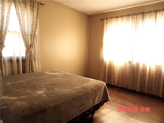 bedroom featuring hardwood / wood-style flooring