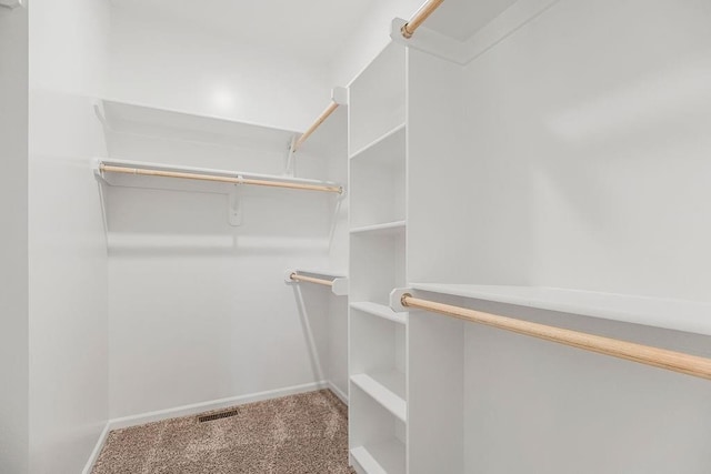 walk in closet with carpet floors and visible vents