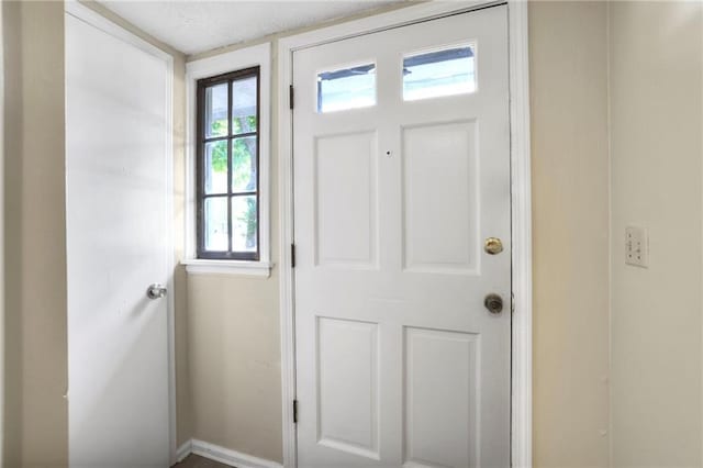 foyer entrance featuring a textured ceiling