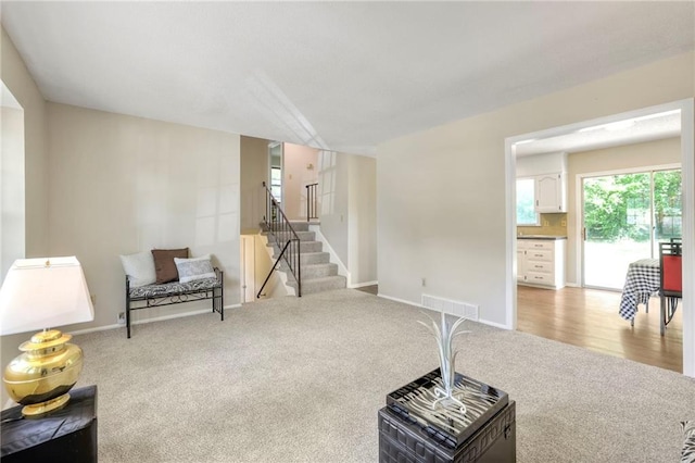 living area with light hardwood / wood-style flooring