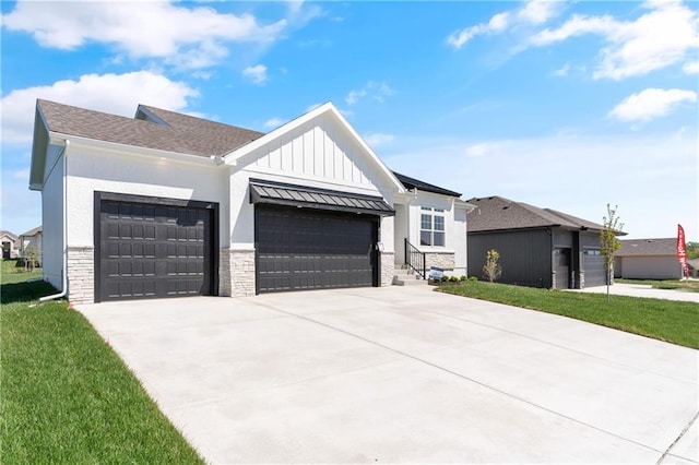 modern inspired farmhouse with a front lawn and a garage