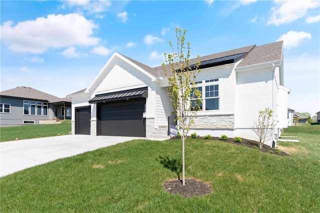 view of front of house with a front lawn and a garage