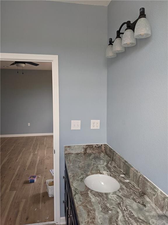 bathroom featuring hardwood / wood-style floors, vanity, and toilet